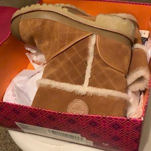Brown Tory Burch boot and size 10 .